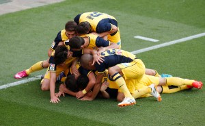 Atletico Madrid players celebrate Godin's goal against Barcelona during their Spanish first division soccer match at  Nou Camp stadium in Barcelona